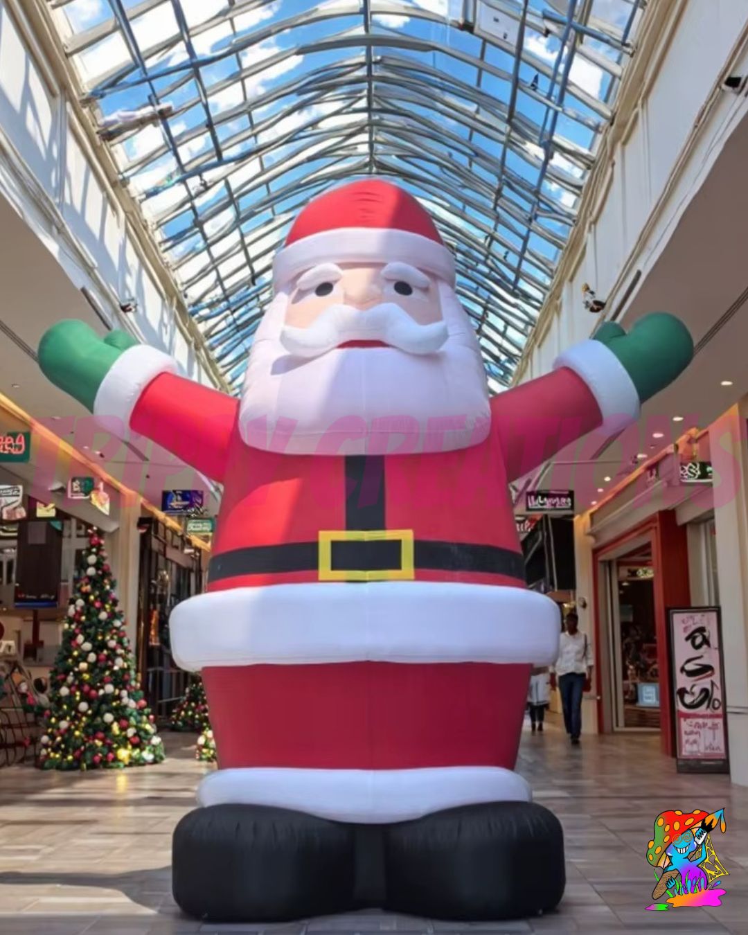 Giant inflatable Santa Claus displayed by a customer in a glass-roofed commercial atrium