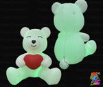 Two inflatable teddy bears, one with a red heart and the other glowing green, on a black background with 'Trippy Creations' branding.