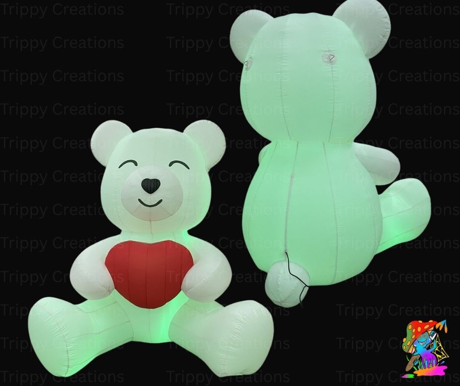 Two inflatable teddy bears, one with a red heart and the other glowing green, on a black background with 'Trippy Creations' branding.