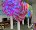 Hanging LED lollipop decoration for sweet-themed events
