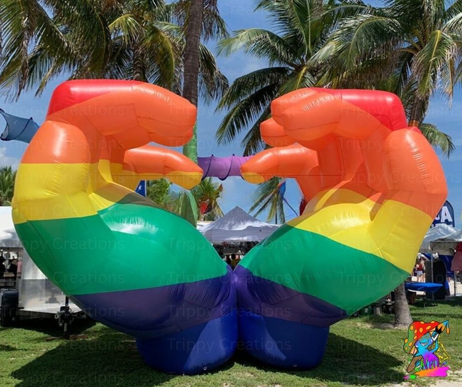 Rainbow inflatable hands forming a heart for Pride celebrations