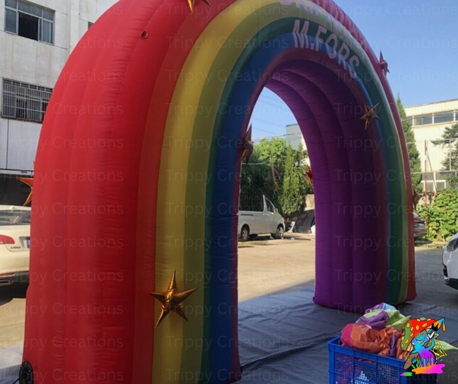 Large inflatable rainbow backdrop with personalised design