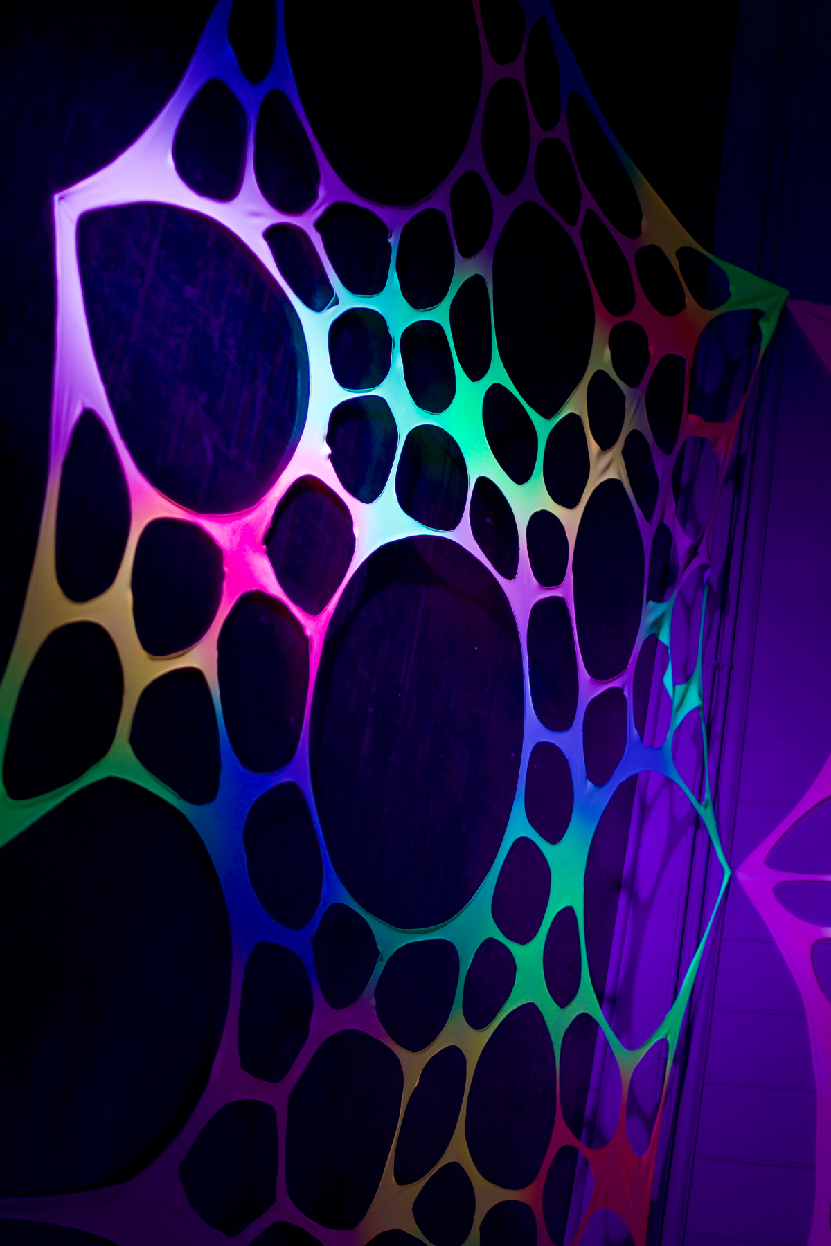 Medium UV Rainbow Party Hire Bundle – Psychedelic Stretch Webs with Pixie & Mushroom Wall Hanging