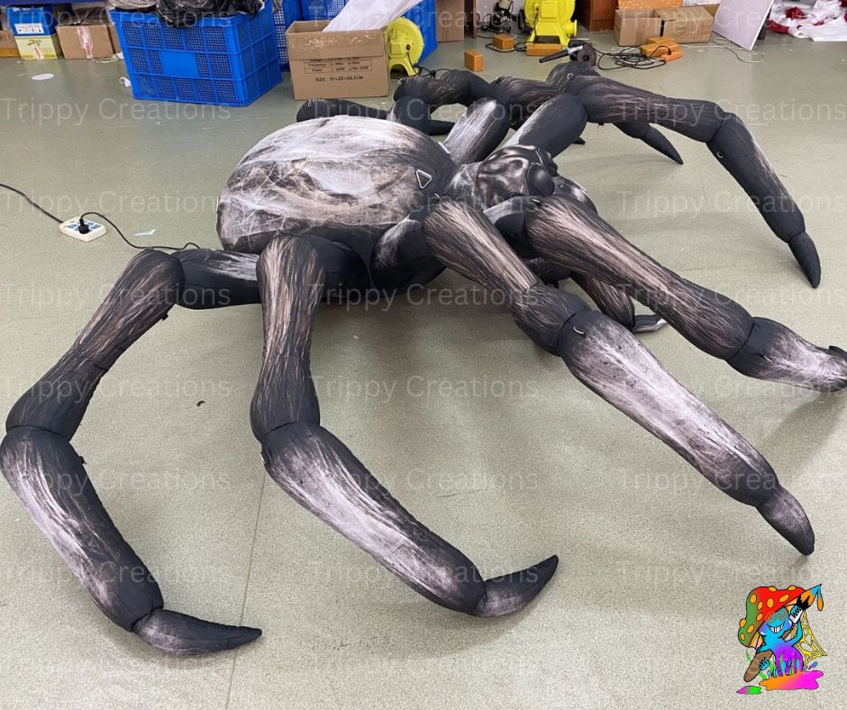 Halloween-themed garden display featuring giant inflatable spider and spooky lighting