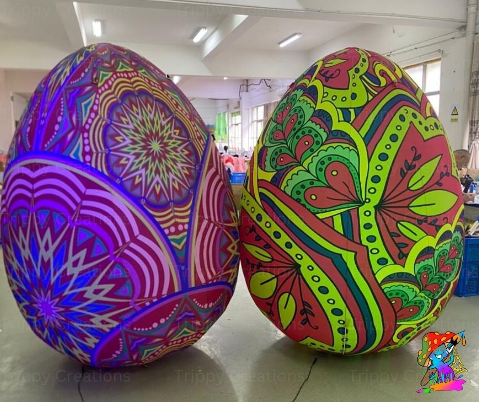 Two large, colorful Easter eggs with intricate patterns in a warehouse setting.