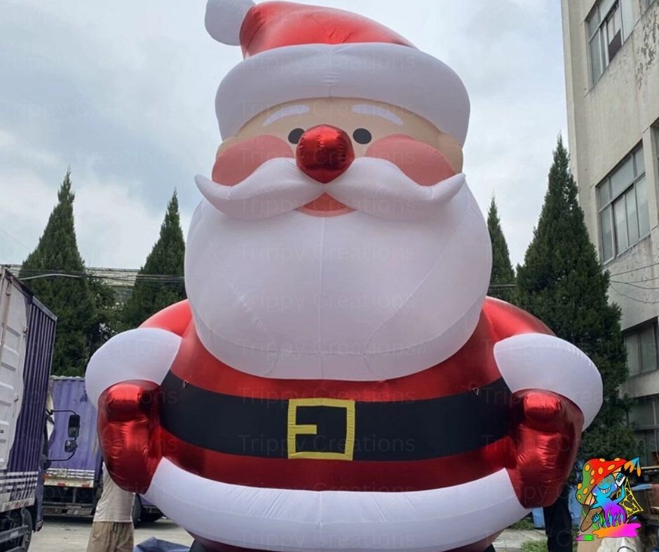 Inflatable Santa Claus figure in front of a building with trees in the background
