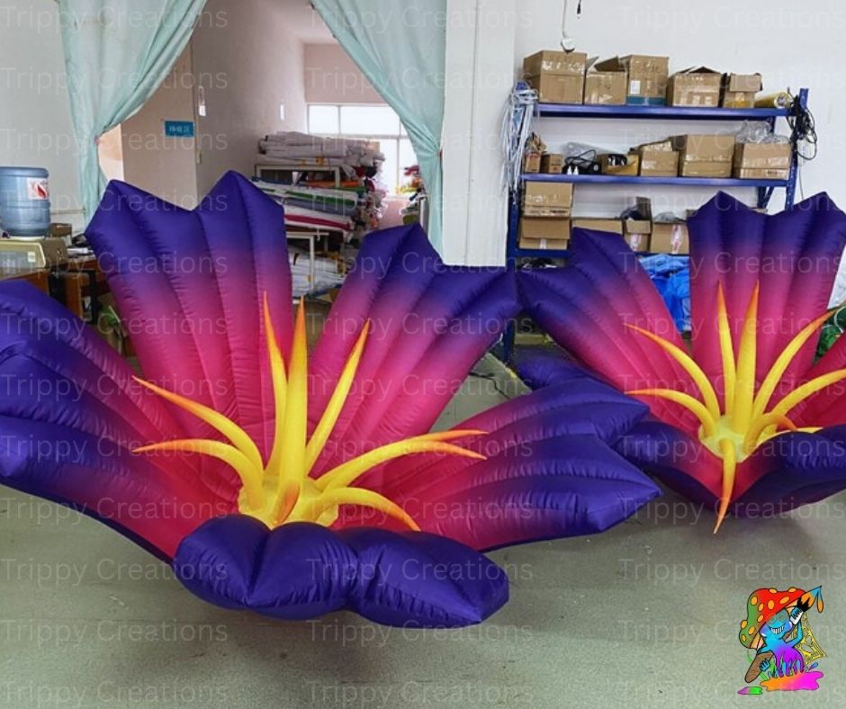 Inflatable flower decorations with purple, pink, and yellow colors in a storage room.