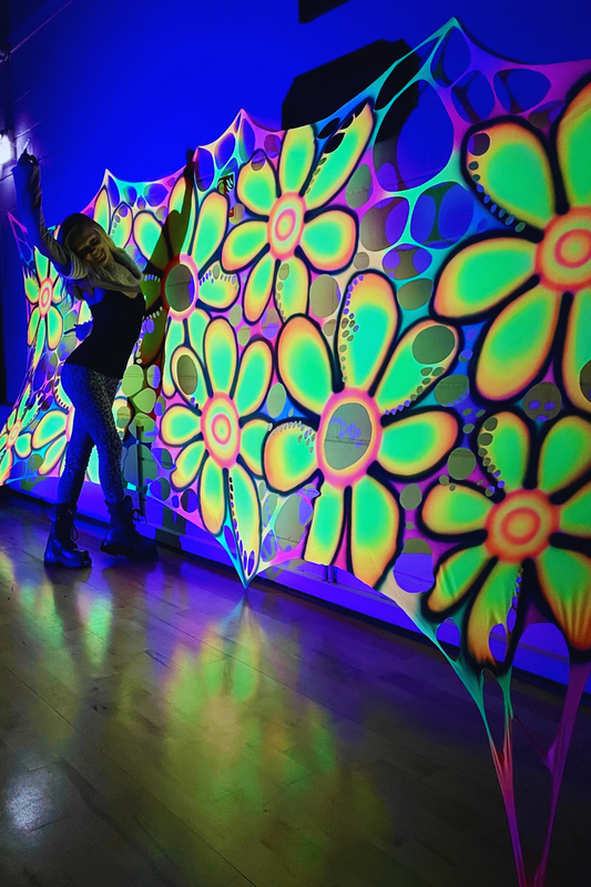 Neon daisy backdrop props for flowery themed events