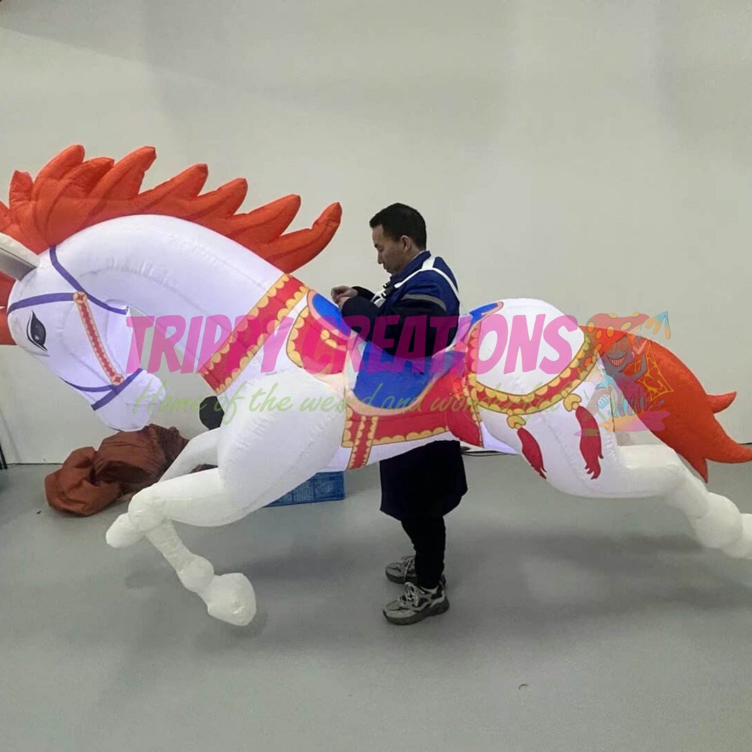 3 metre walking inflatable unicorn with flashing LED lighting for festivals and family events.