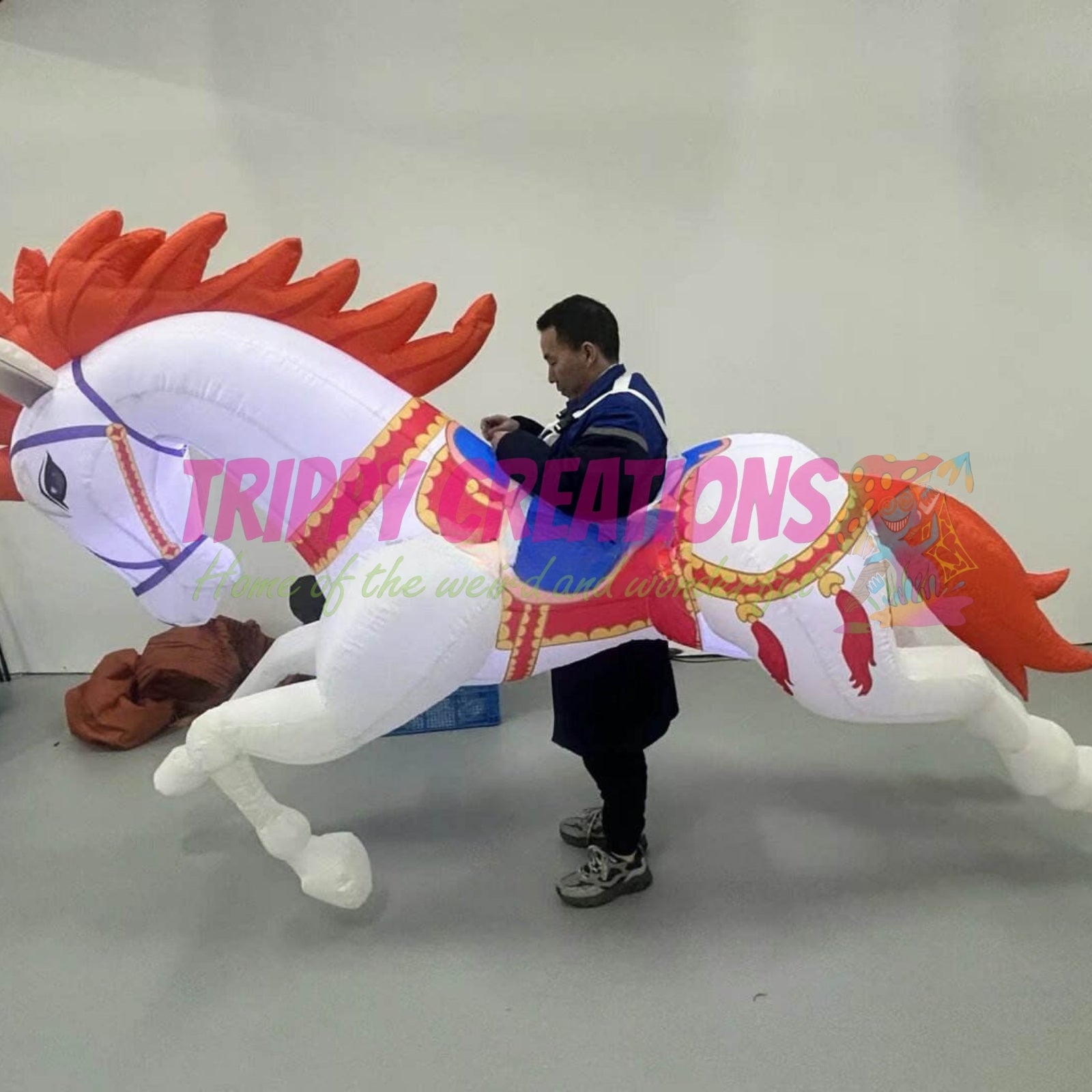 3 metre walking inflatable unicorn with flashing LED lighting for festivals and family events.
