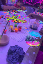 UV painting station for interactive festival activities
