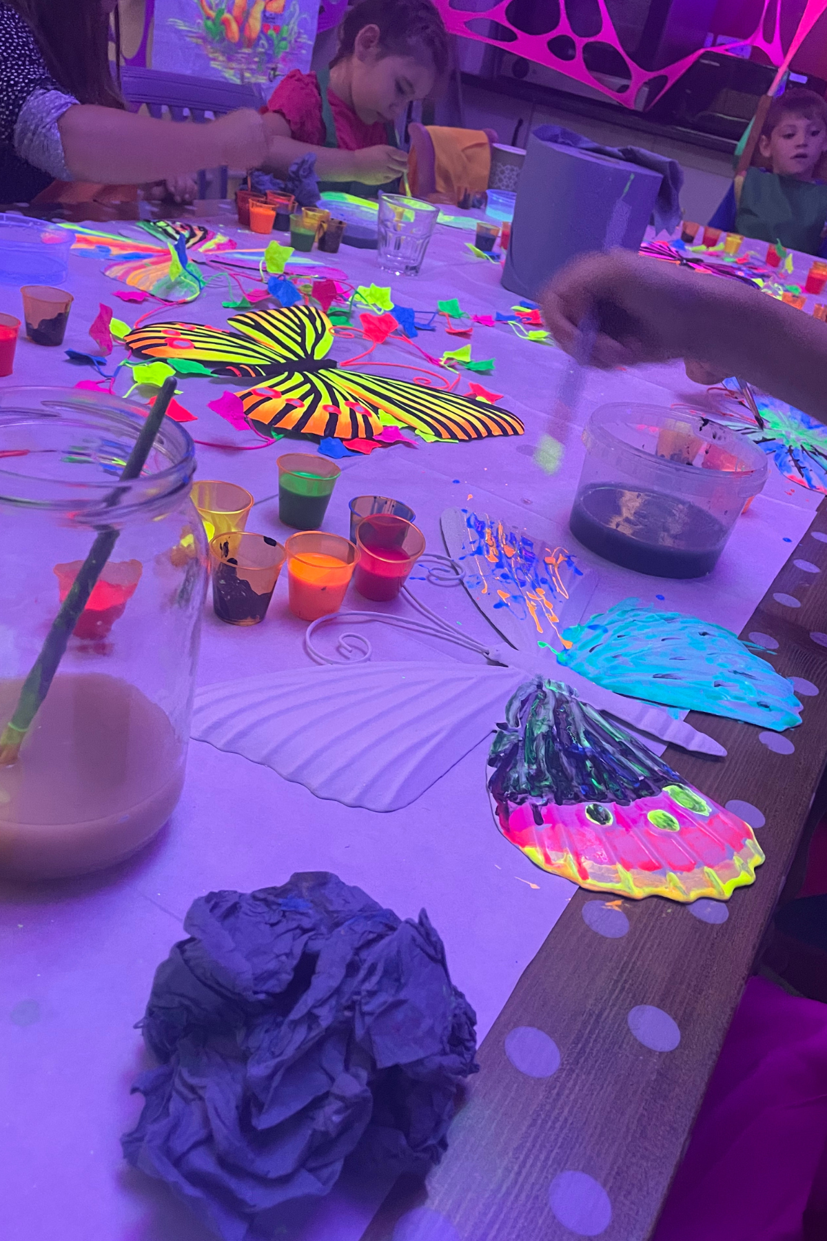 UV painting station for interactive festival activities
