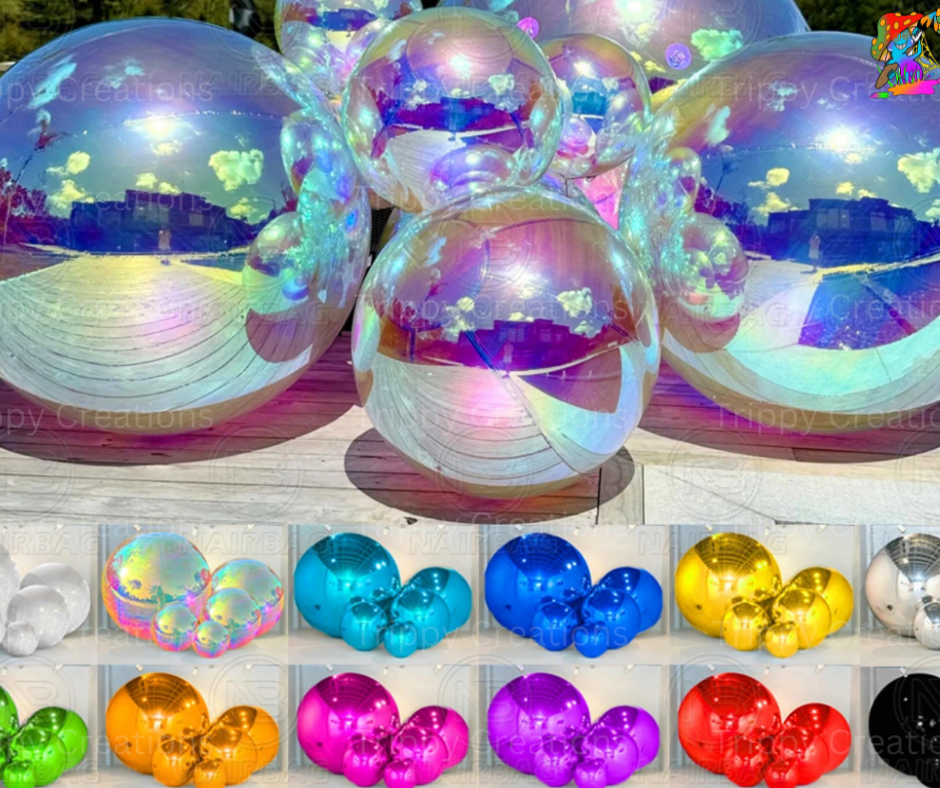 A selection of inflatable balls in various sizes and colors, displayed both stacked and spread out, with a reflective, shiny surface.