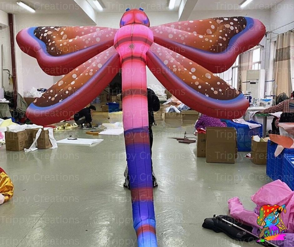 Inflatable dragonfly decoration in a warehouse setting