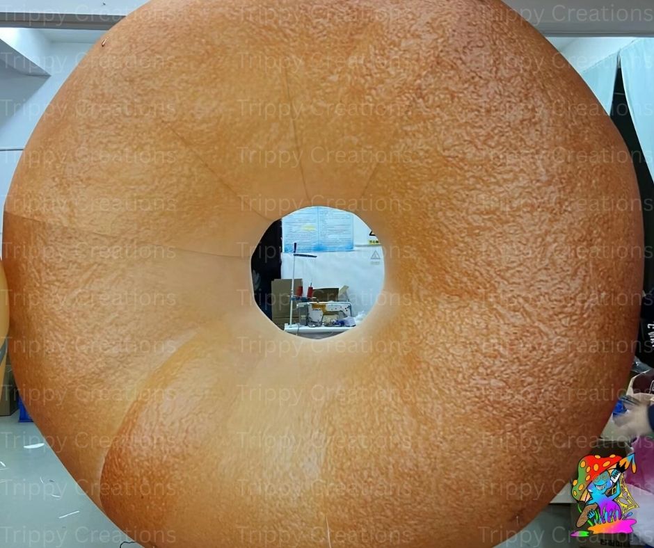 Large inflatable donut with a hole in the center, used as a prop or decoration.