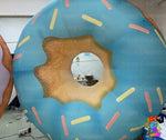 Inflatable donut decoration with sprinkles on a white background
