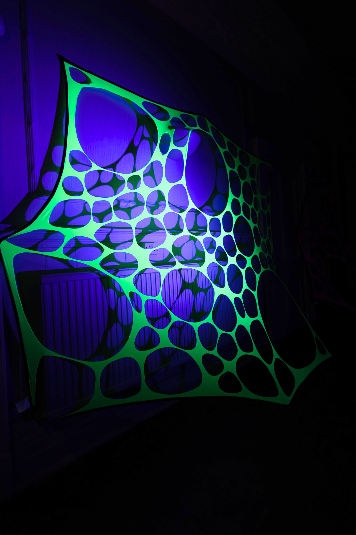 UV Reactive green polka dot event decorations.