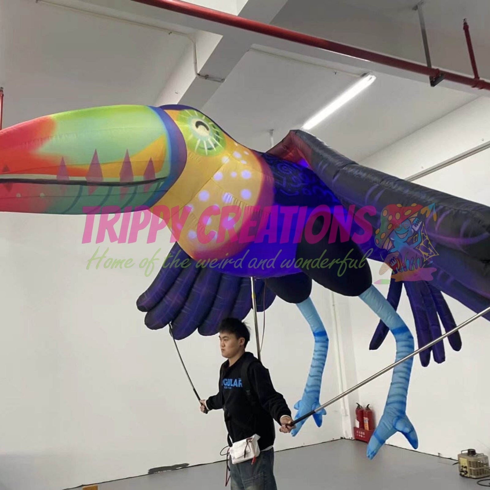 Eye-catching tropical parrot walking act costume creating a vibrant festival atmosphere