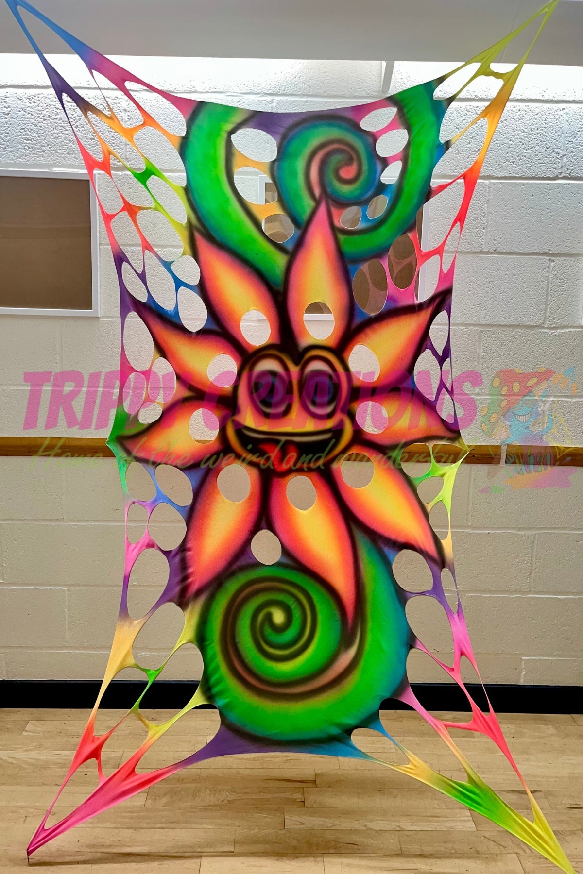 Cheeky tongue-out flower wall hanging for UV parties, raves, and neon events