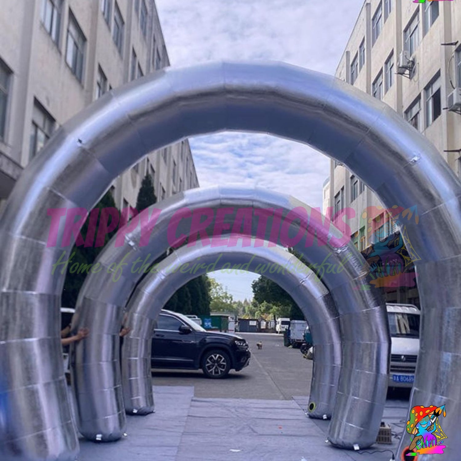 Giant metallic silver reflective inflatable arch creating a premium entrance for corporate events, exhibitions and brand activations.