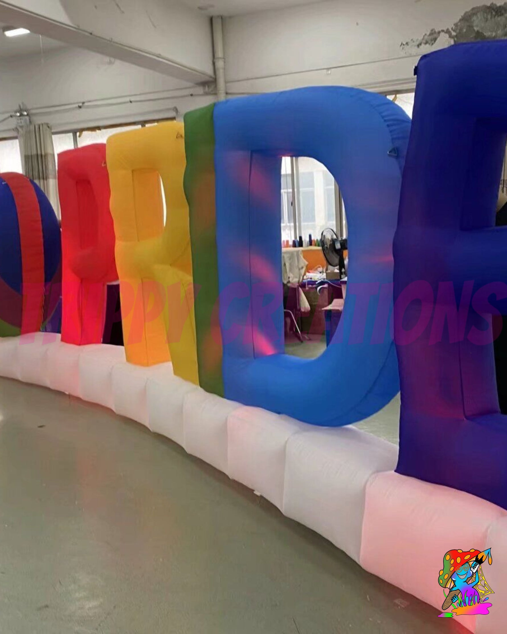 Inflatable Pride event prop with colourful rainbow heart and cloud base