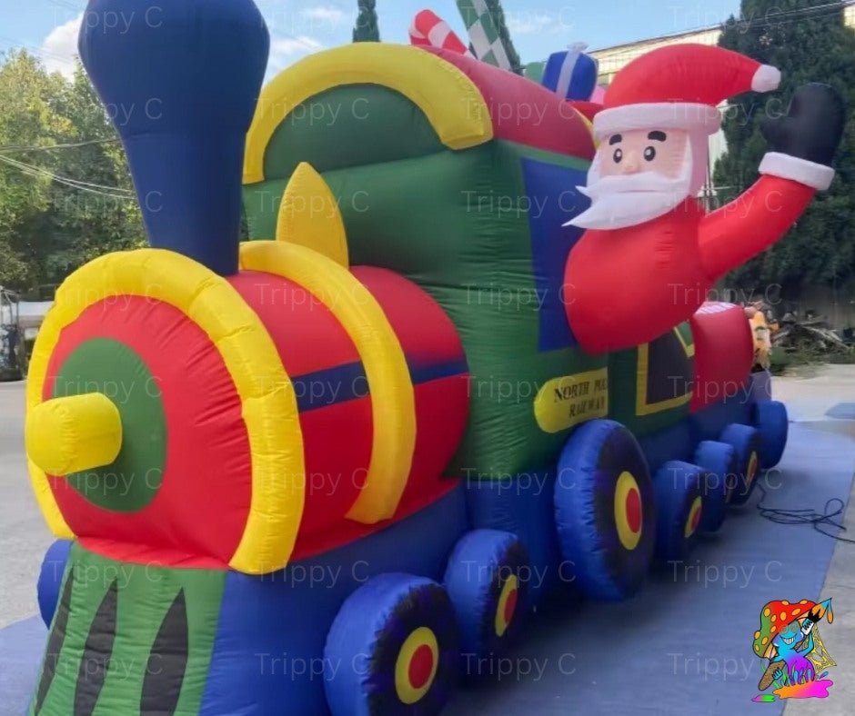 Inflatable train decoration with Santa Claus figure outdoors