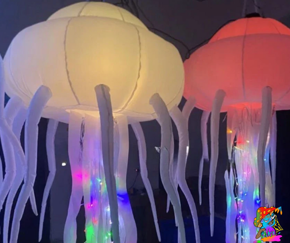 Brightly lit inflatable jellyfish for parties and underwater themes.
