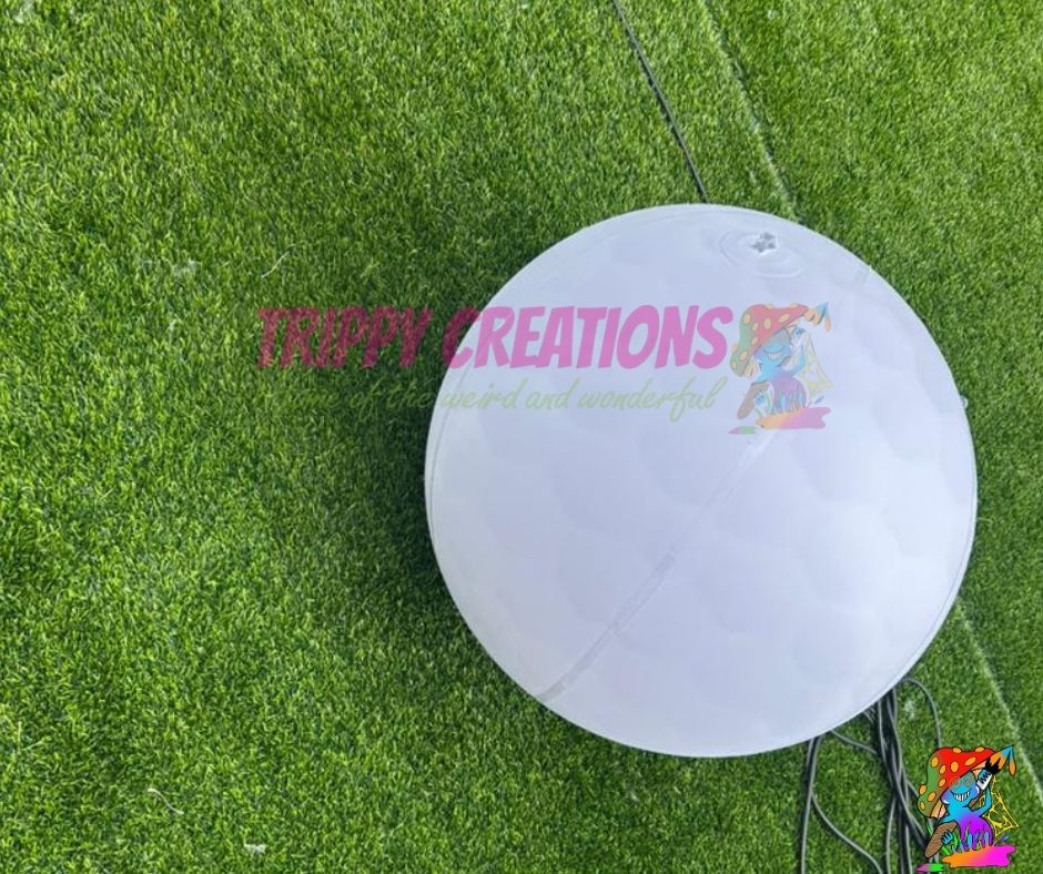 Inflatable golf ball prop for sports themed event ceiling display