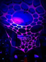 UV-reactive neon tapestry for immersive party experiences