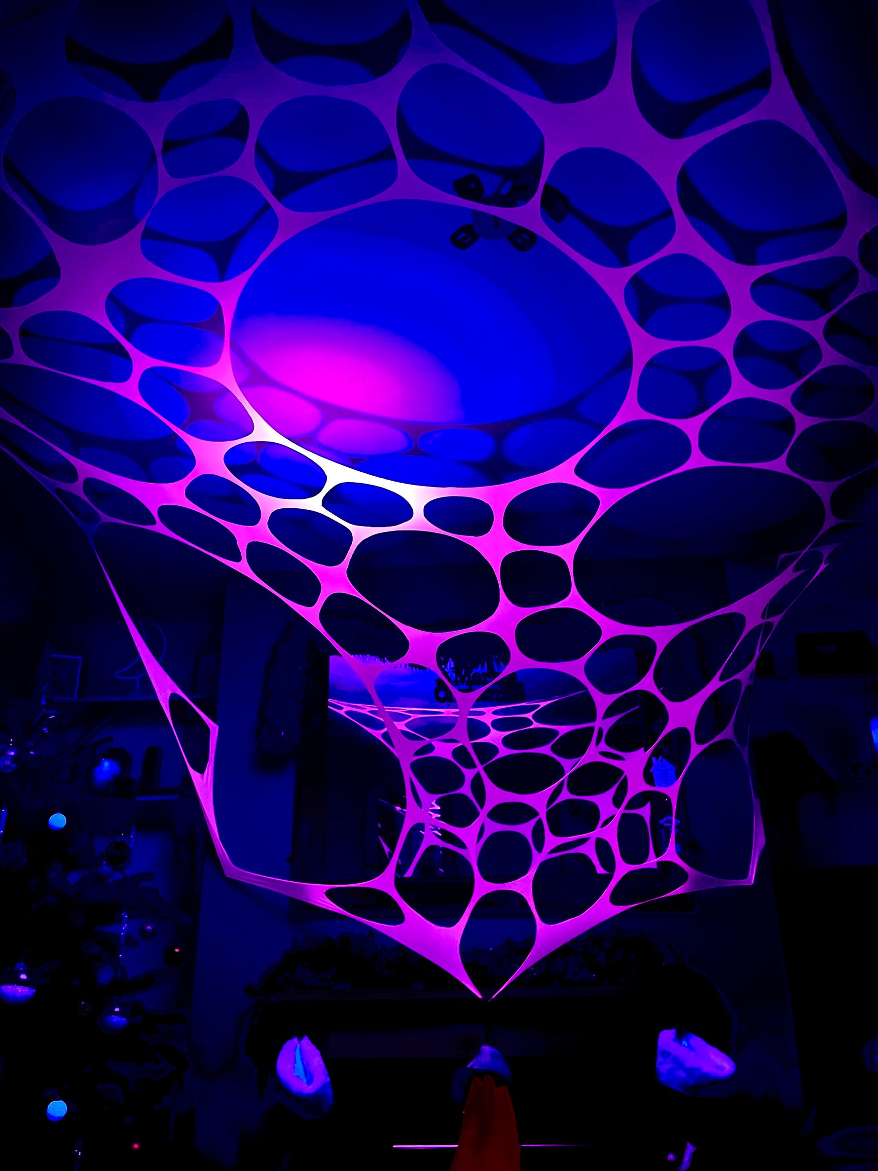 UV-reactive neon tapestry for immersive party experiences