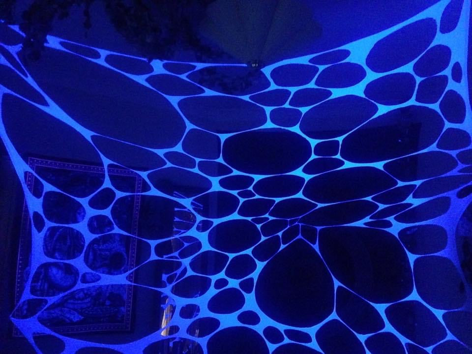 Large UV-reactive wall tapestry for party decoration