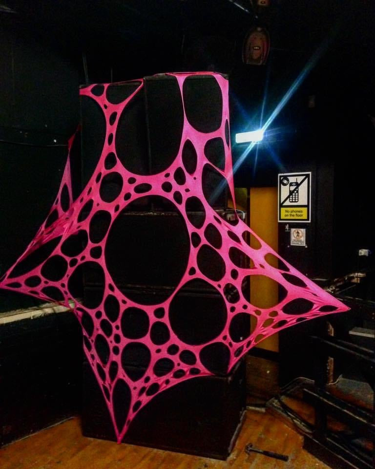 Glow-in-the-dark trippy tapestry for hire for raves