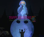 inflatable astronaut sitting on moon prop for space themed events