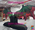 glowing LED bat wings inflatable lighting up dark event space for atmosphere