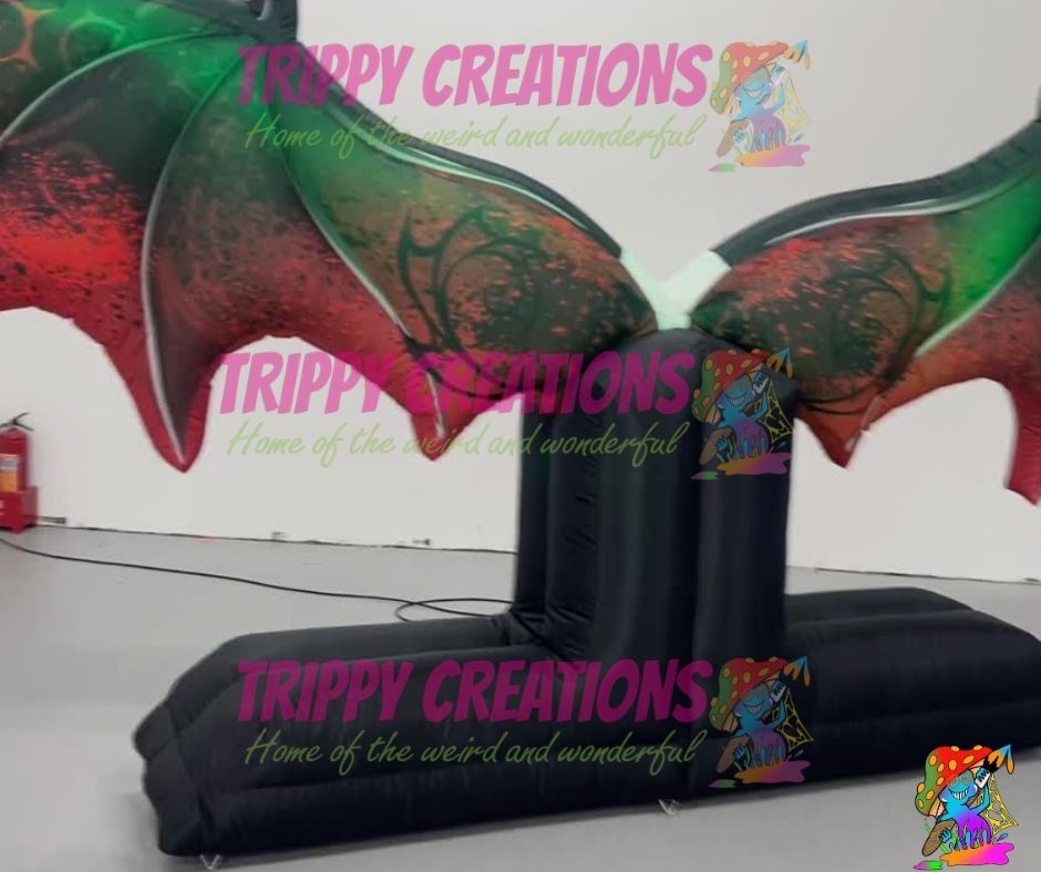 illuminated bat wings inflatable used as interactive selfie backdrop at party
