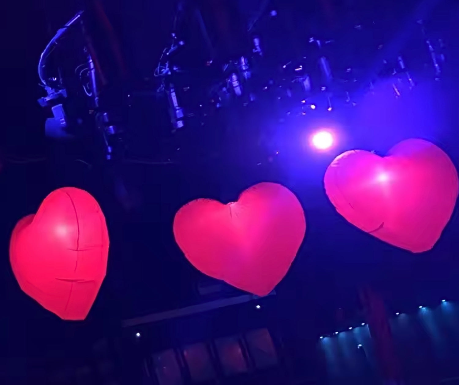 Bright LED inflatable heart adding ambiance to a party setting
