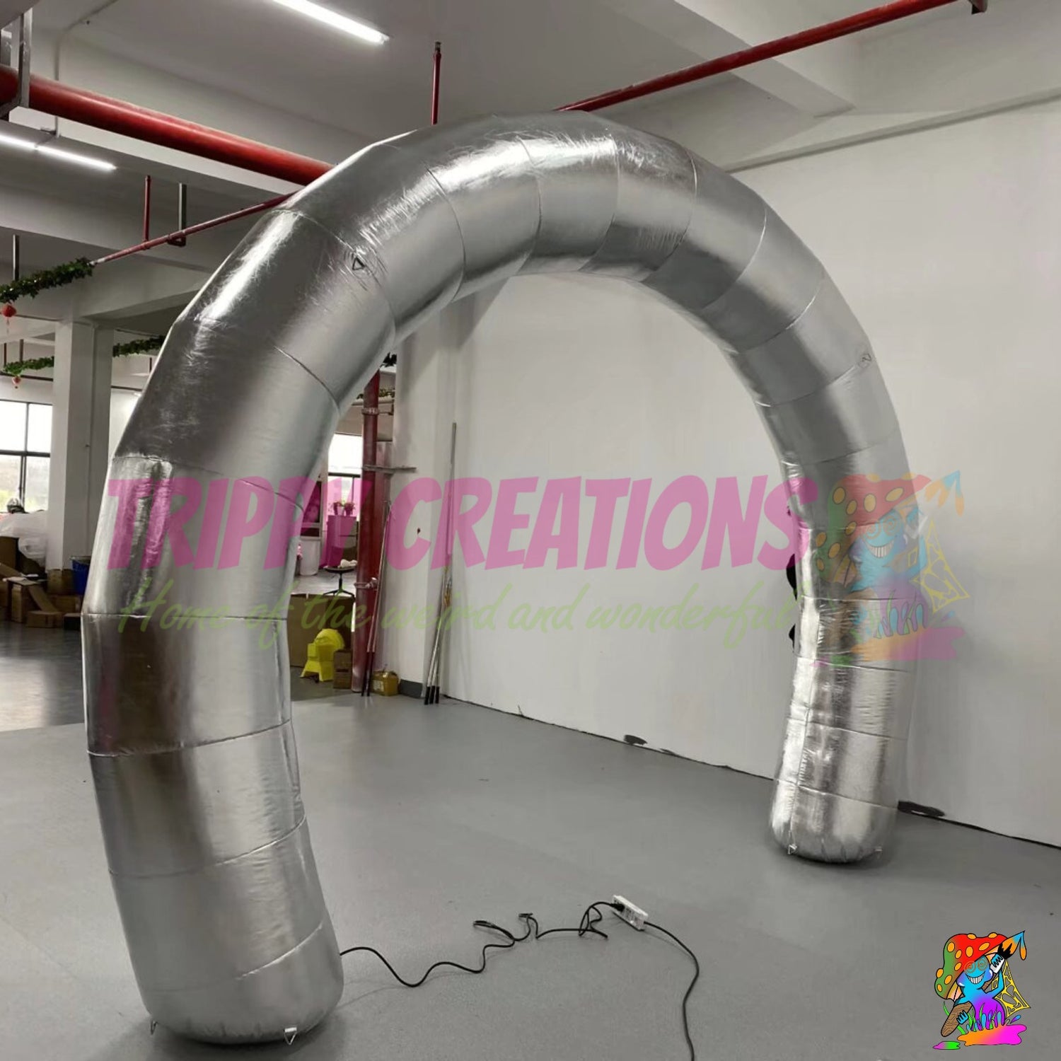 Large metallic silver inflatable arch installed at a commercial event to create a striking and memorable guest entrance.