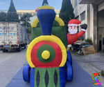 Inflatable train with colorful design and a character on top, outdoors.