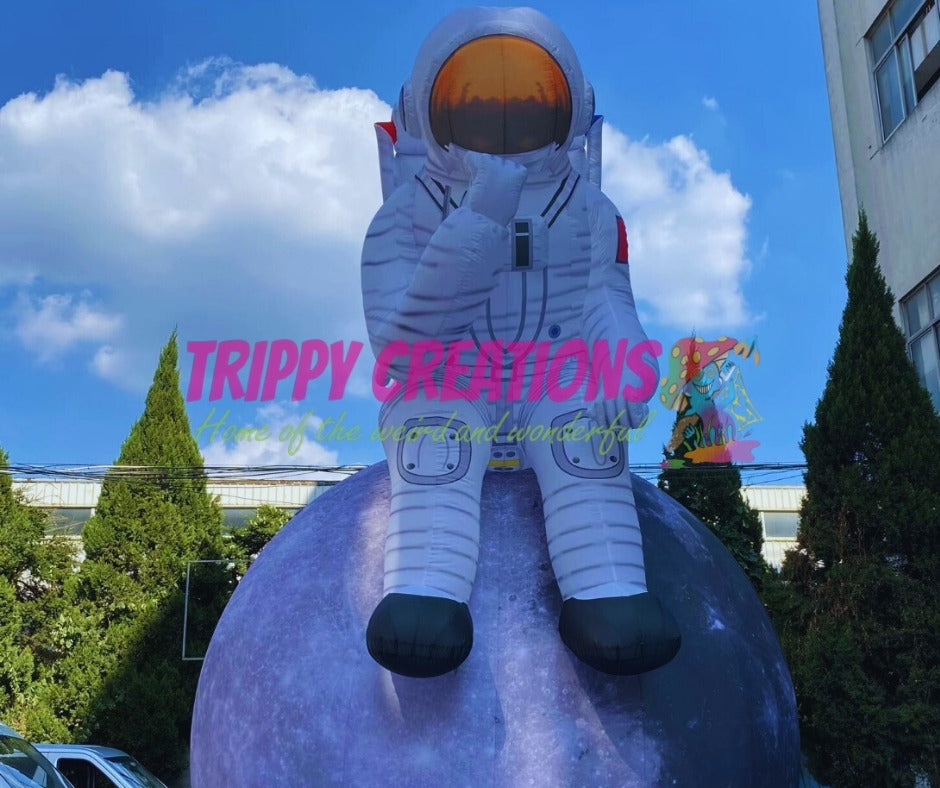 space themed inflatable astronaut on moon for events