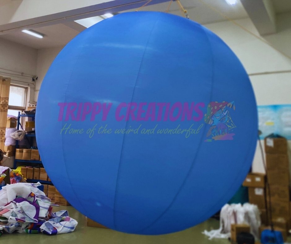 inflatable planet decorations hanging from ceiling