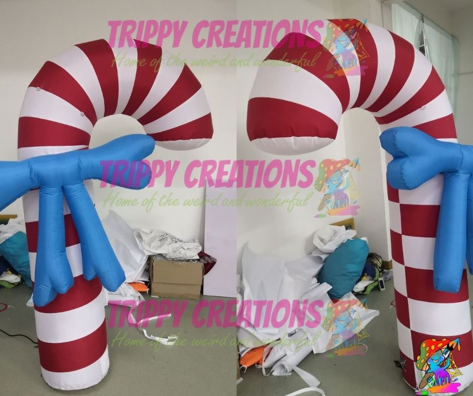 Red and White Swirl Inflatable Candy Cane with Blue Ribbon Detail
