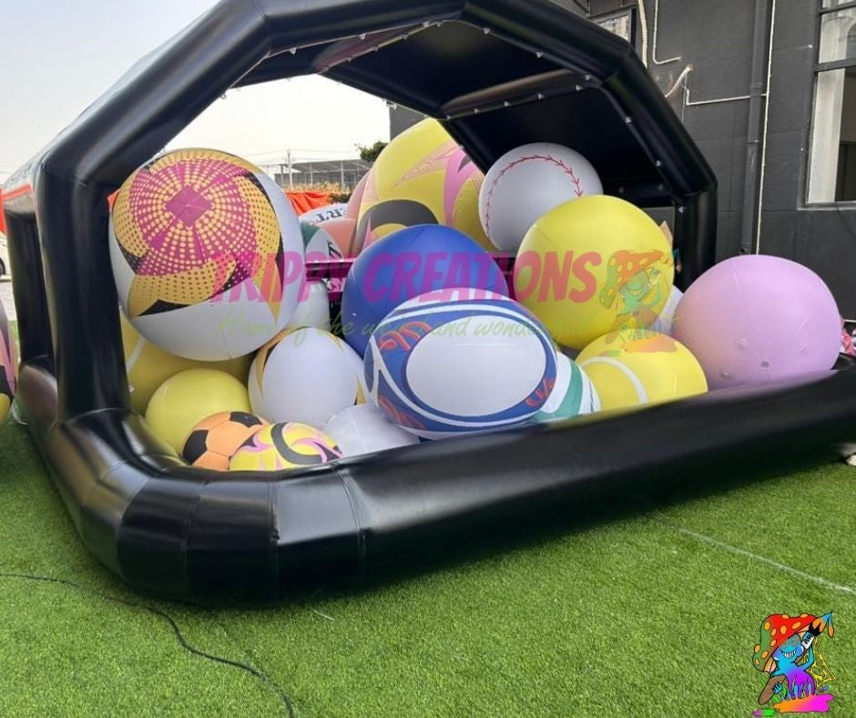 Inflatable pool toy with colorful balls inside, on grass.