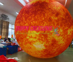 Large inflatable ball with 'Trippy Creations' branding in a room setting.