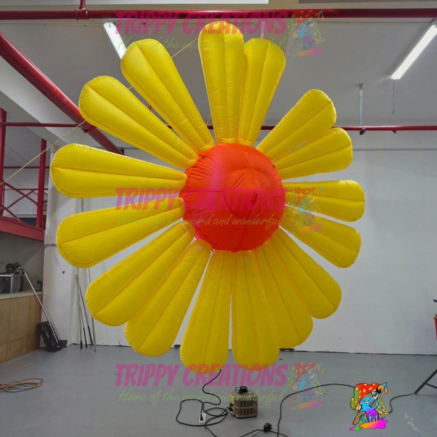 Giant yellow inflatable daisy flower decoration with orange center, made of polyester taffeta. Ideal for events.