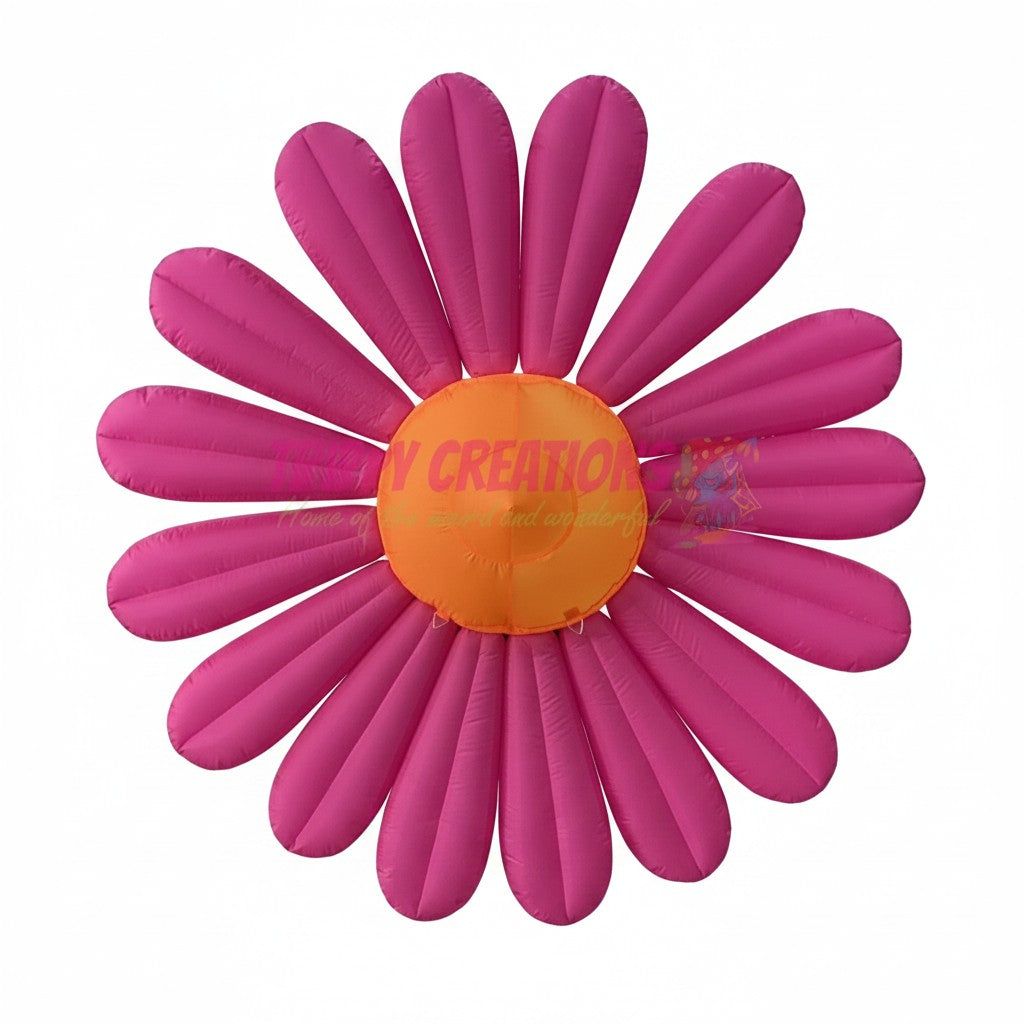 Trippy Creations giant pink inflatable daisy flower decoration with orange center, made of polyester taffeta.
