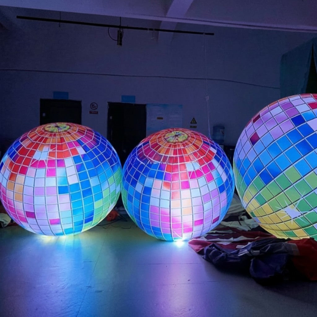 Trippy Creations giant inflatable disco ball decoration with colorful mosaic pattern and internal LED lights.