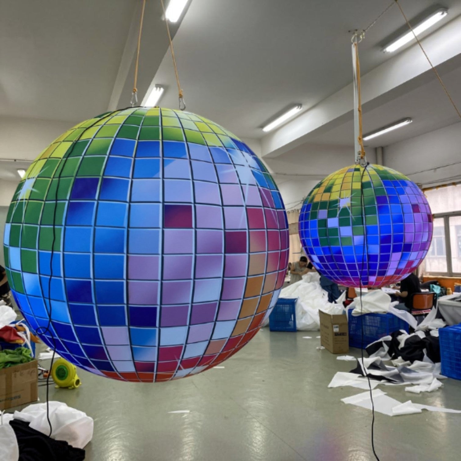 Trippy Creations giant inflatable disco ball decoration with rainbow LED lights, perfect for parties and events.
