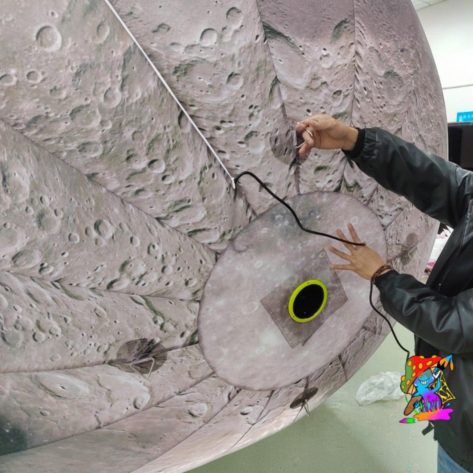 Trippy Creations giant inflatable moon decoration with realistic crater details, perfect for events.