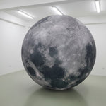 Trippy Creations giant inflatable moon decoration with realistic crater details, perfect for events and parties.