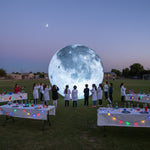Trippy Creations giant LED inflatable moon decoration, realistic grey and white surface with craters, perfect for events and parties.
